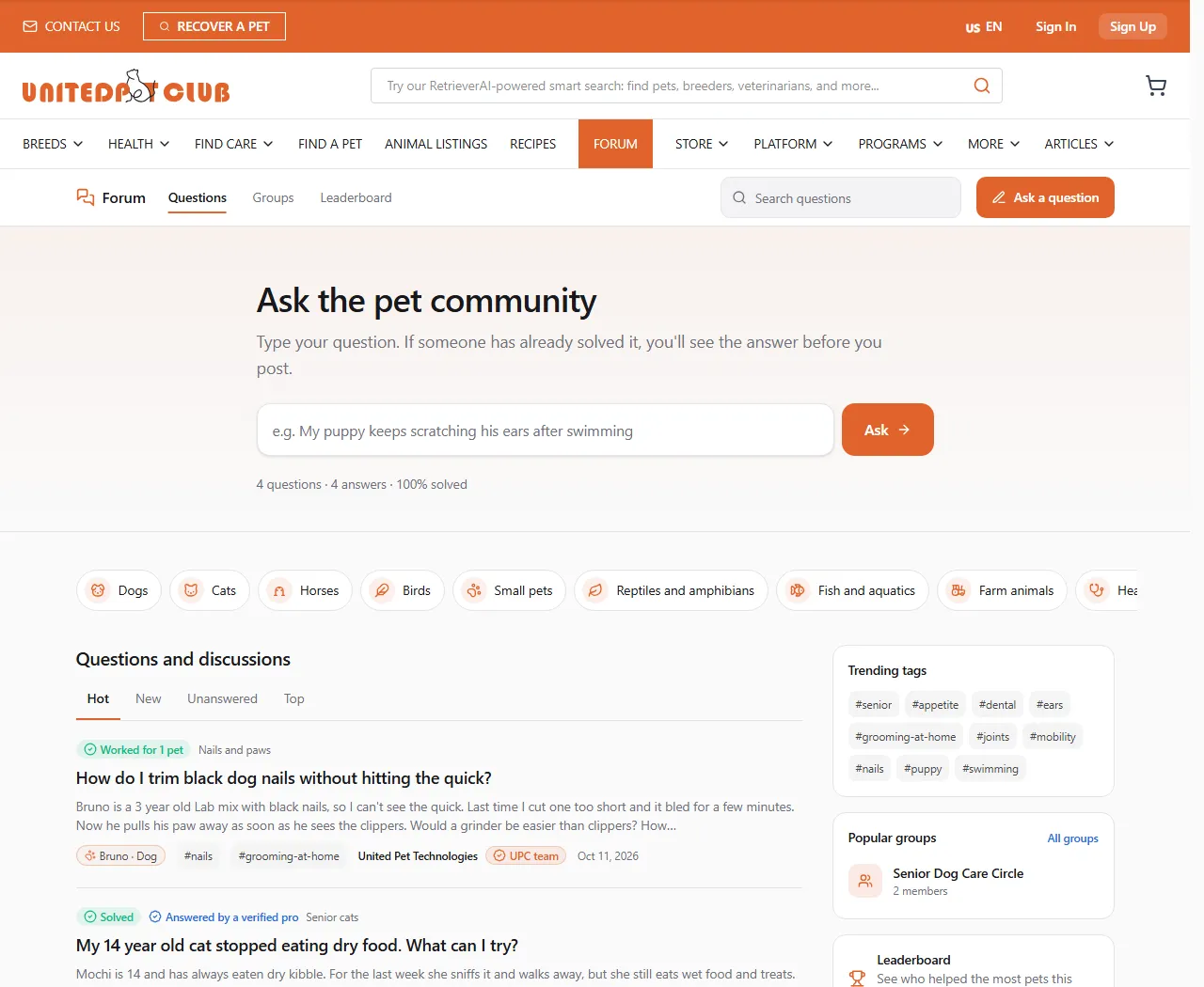 The forum home: the forum bar with Questions, Groups, Leaderboard, search and Ask a question; the "Ask the pet community" box with the Ask button and the totals line "4 questions · 4 answers · 100% solved"; the topic chips (Dogs, Cats, Horses, Birds, Small pets…); and the start of the "Questions and discussions" feed with Hot, New, Unanswered and Top
